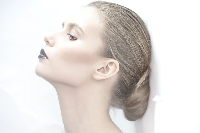 woman with dark lipstick in profile