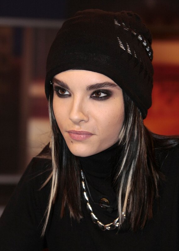 woman with dark makeup and beanie