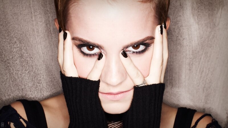 woman with dark makeup and black nails