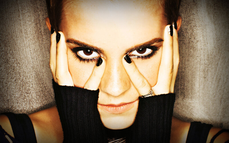 woman with dark makeup and black nails