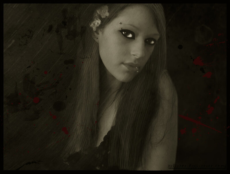 woman with dark makeup and blood splatters