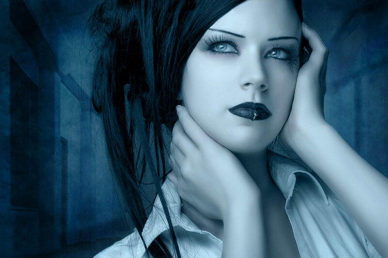 woman with dark makeup and blue lighting