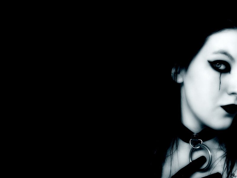 woman with dark makeup and choker