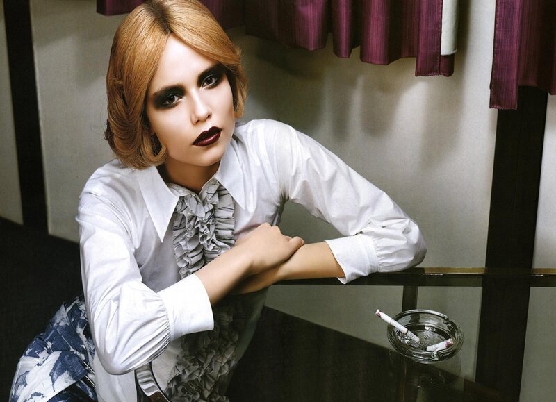woman with dark makeup and cigarette