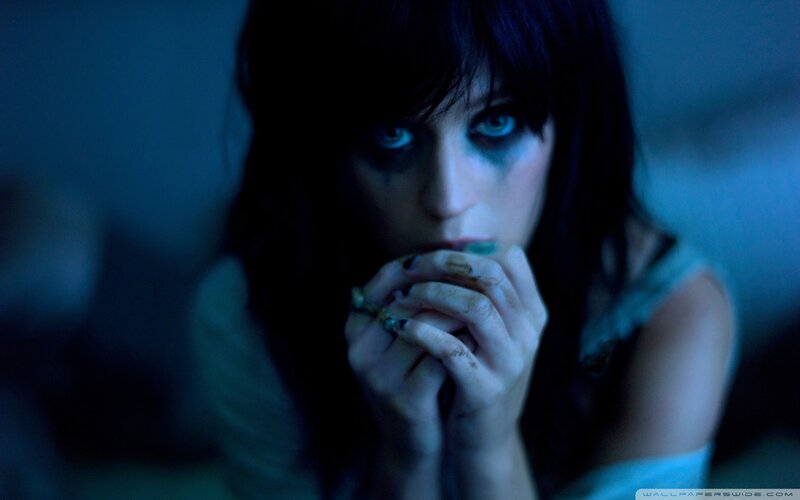 woman with dark makeup and hands