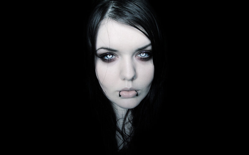 woman with dark makeup and piercing