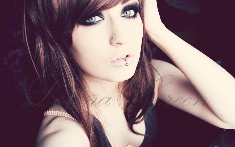 woman with dark makeup and piercings