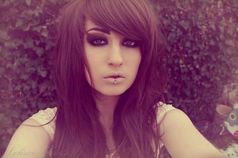 woman with dark makeup and piercings