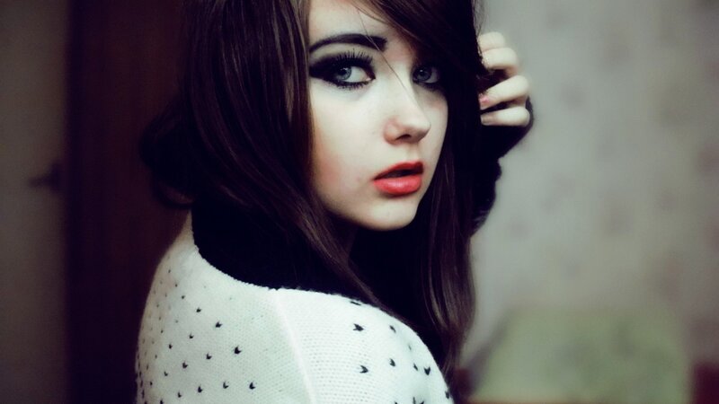 woman with dark makeup and red lips