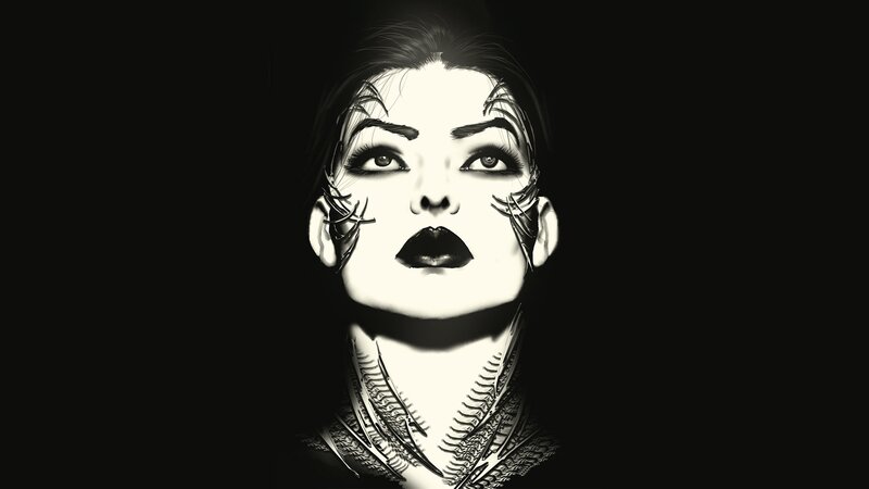 woman with dark makeup and tattoos