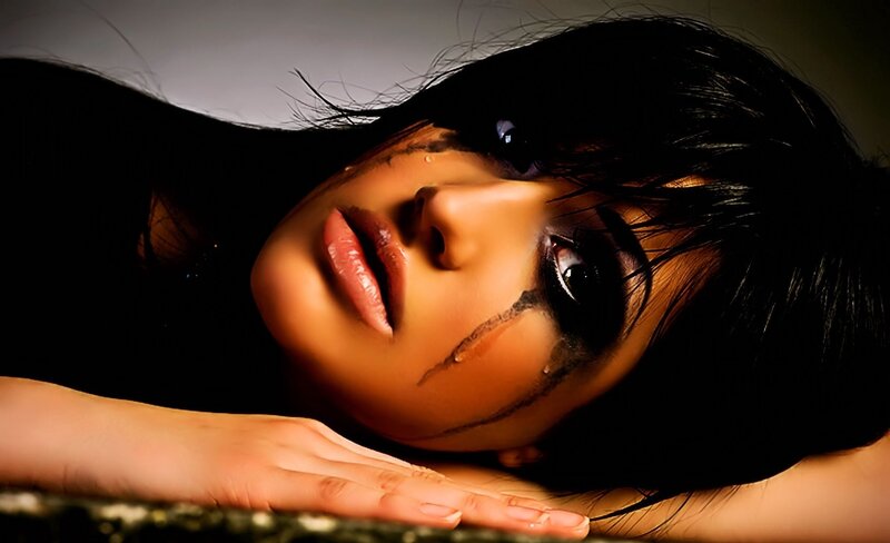 woman with dark makeup and tears