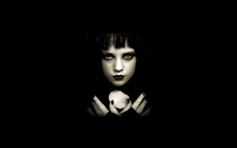 woman with dark makeup in darkness