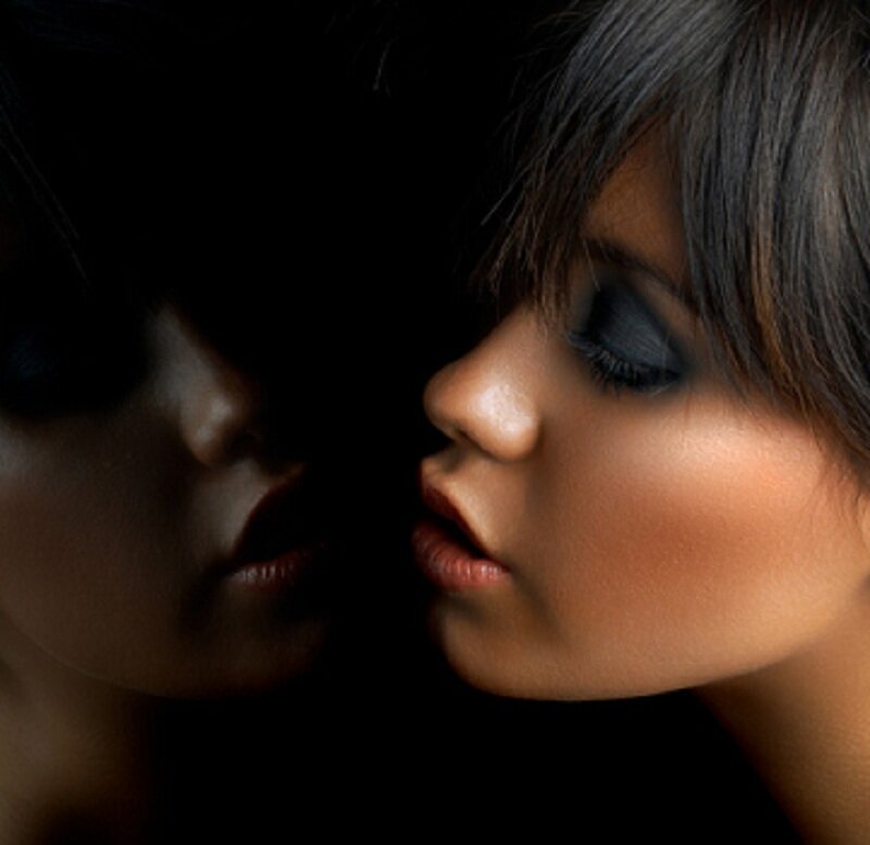 woman with dark makeup in profile