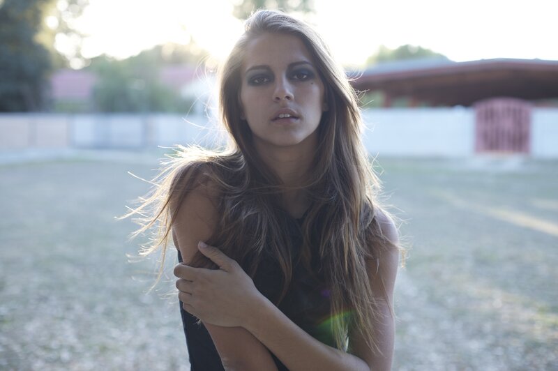 woman with dark makeup outdoors