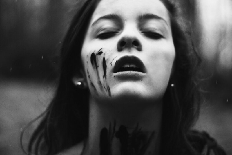 Woman with Dark Marks on Face