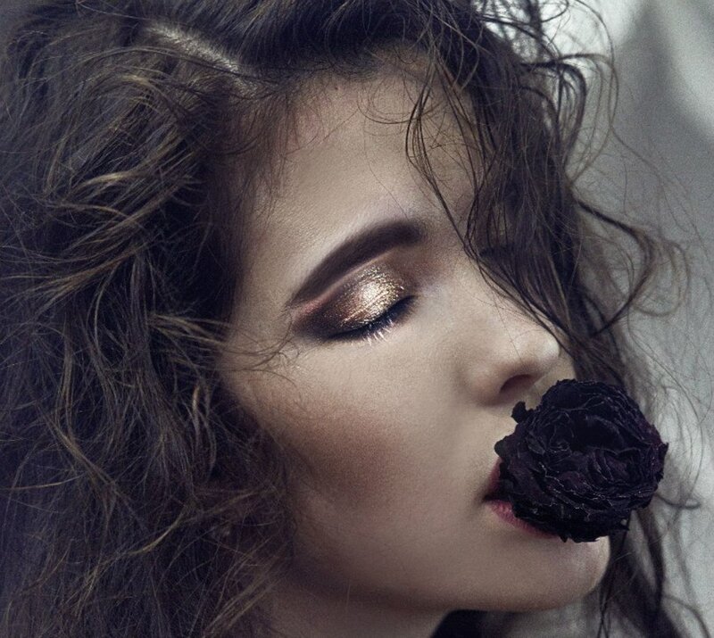 Woman with Dark Rose