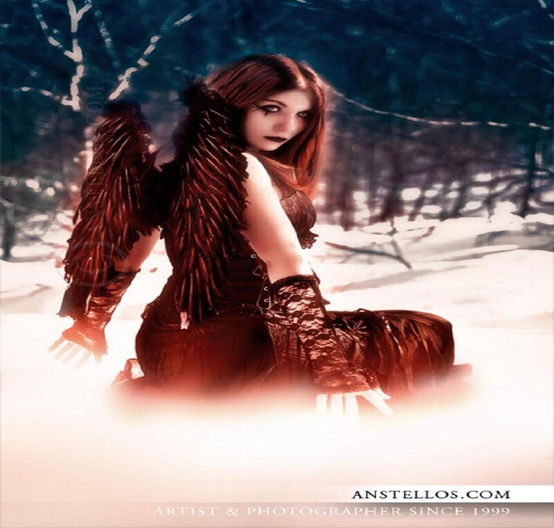 woman with dark wings in snow