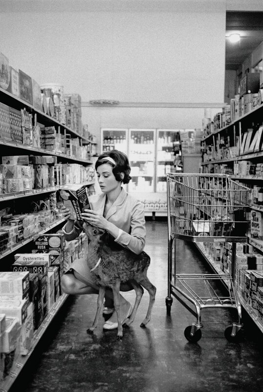 Woman with deer in grocery store