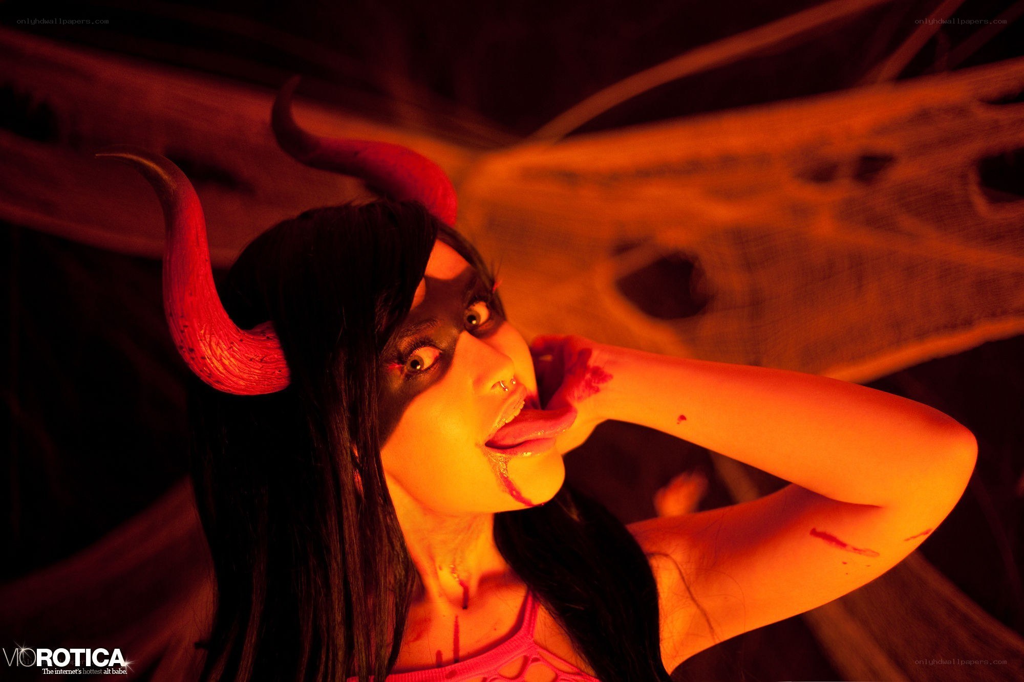 woman with devil horns and makeup