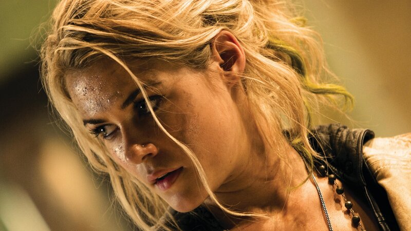 woman with dirty face in action scene