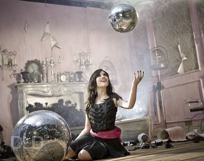 Woman with disco balls in room