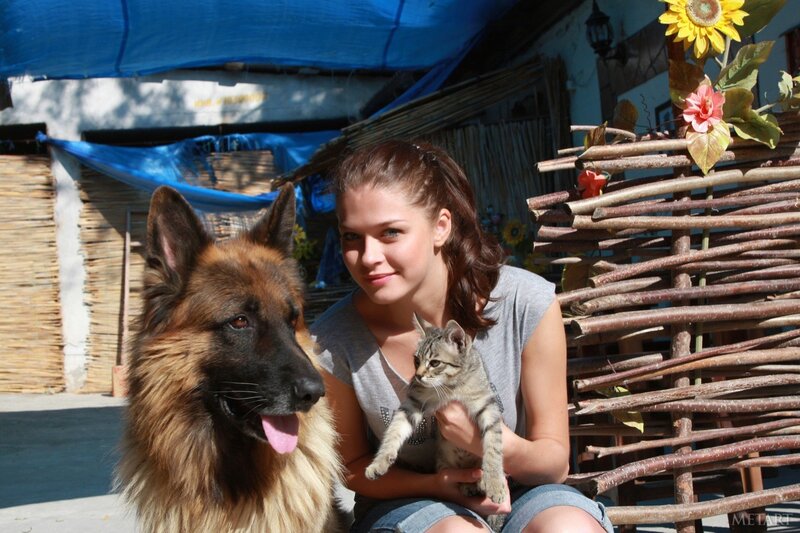Woman with dog and kitten