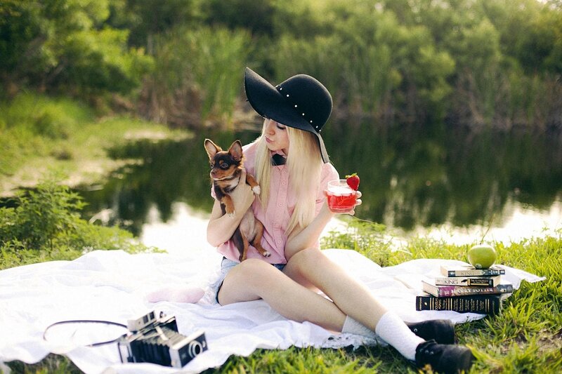 Woman with dog at picnic