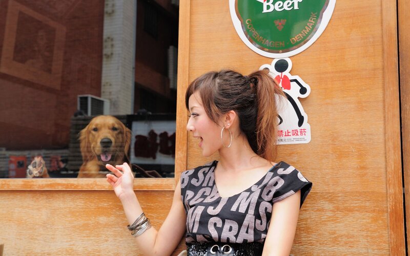 Woman with Dog at Window