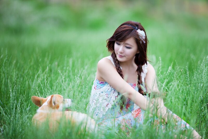 Woman with dog in a field