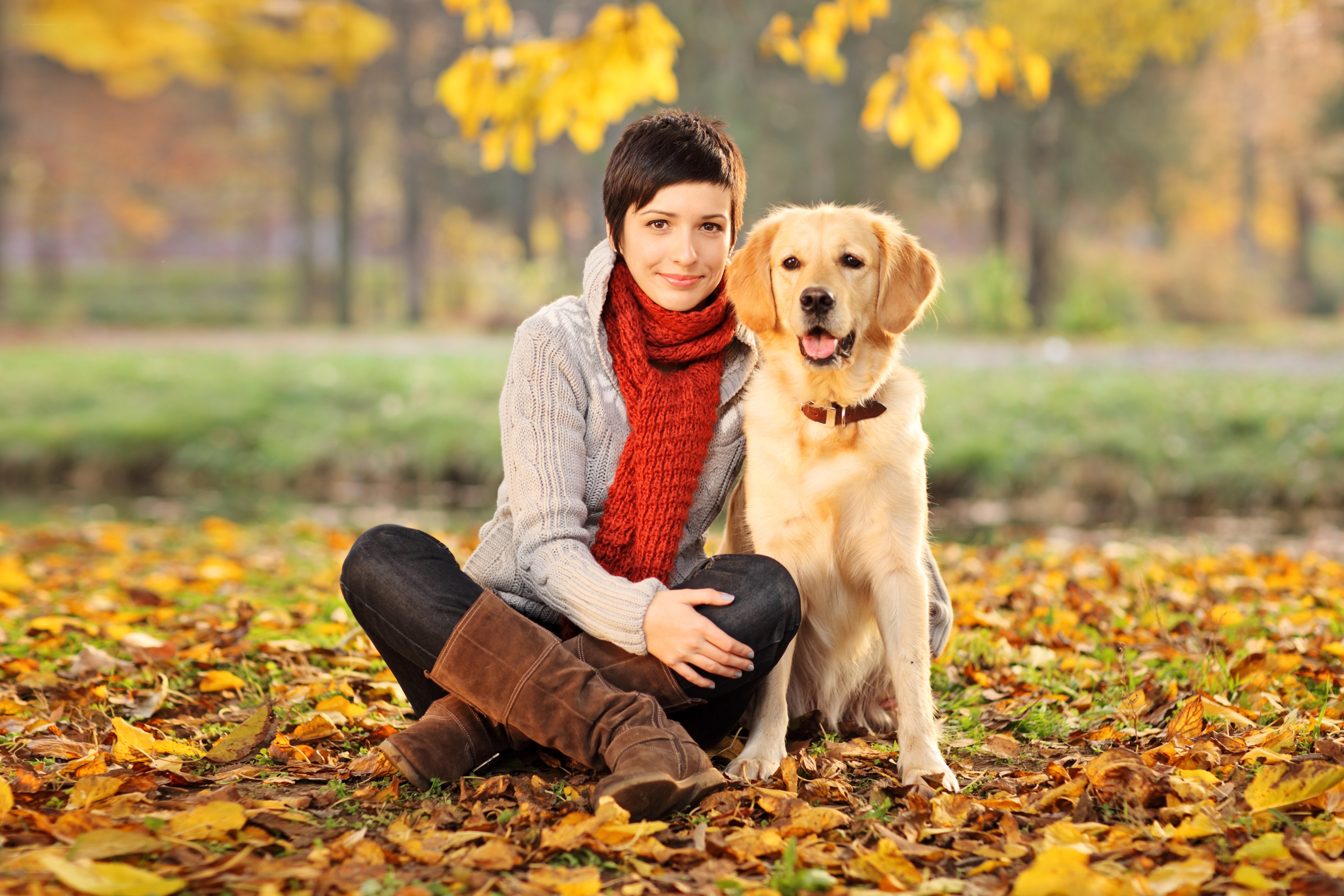 Woman with dog in autumn park