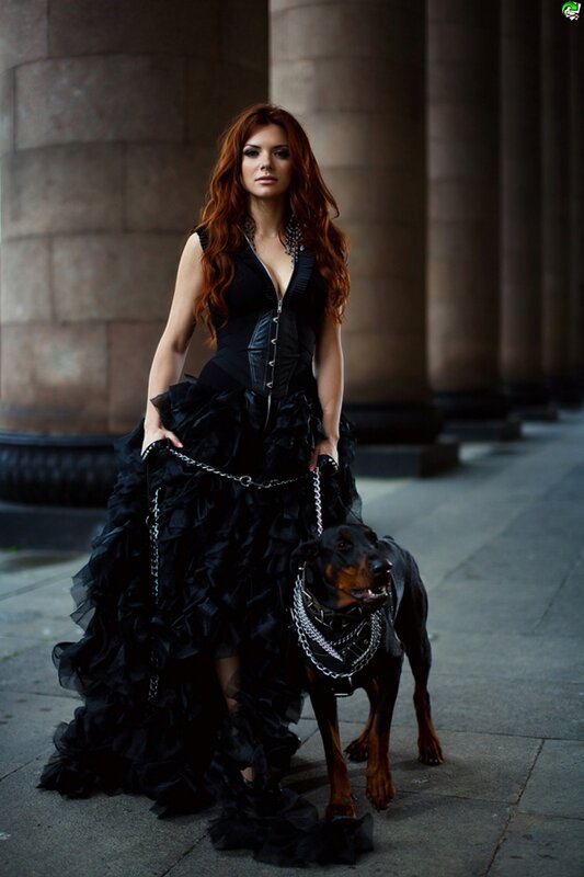 woman with dog in black dress