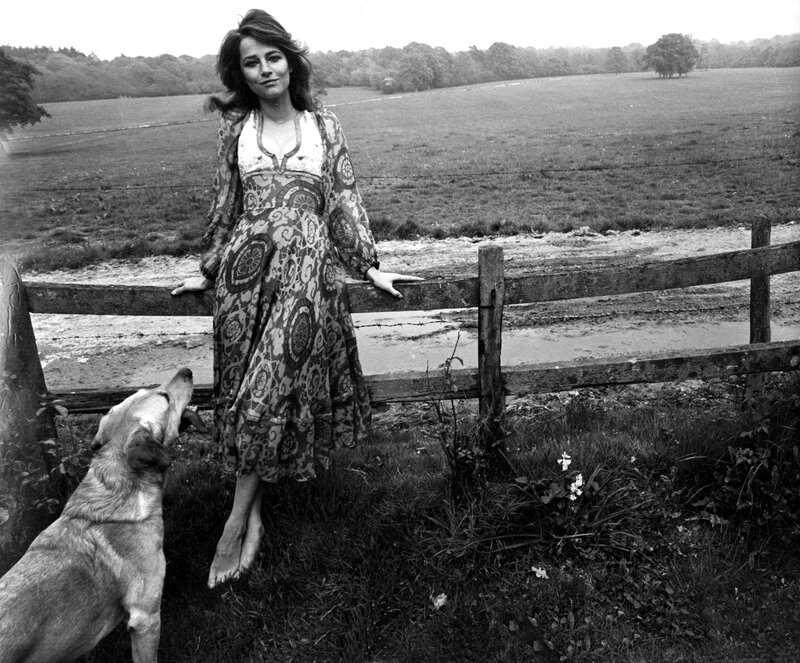 Woman with dog in field