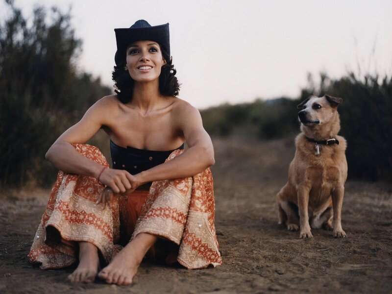 woman with dog in field