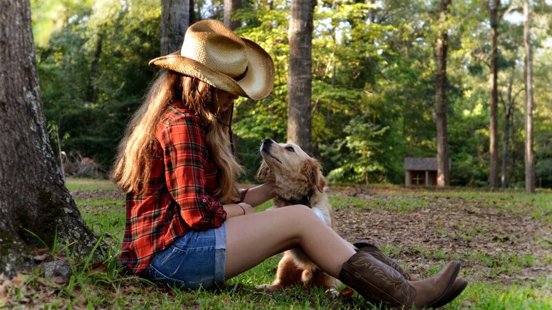 Woman with dog in forest