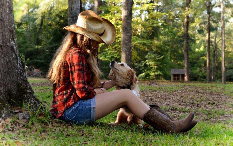 Woman with dog in forest