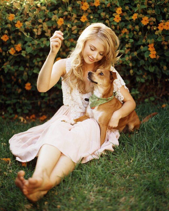 Woman with dog in garden