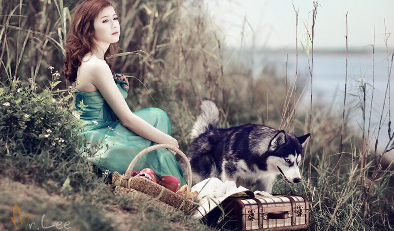 Woman with dog in nature