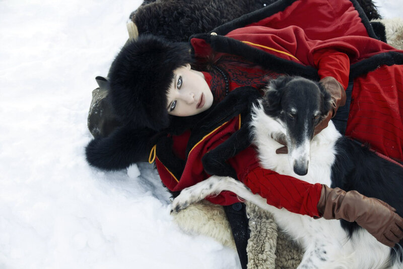 Woman with Dog in Snow — White, Dramatic