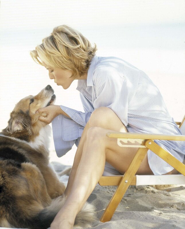 Woman with dog on beach