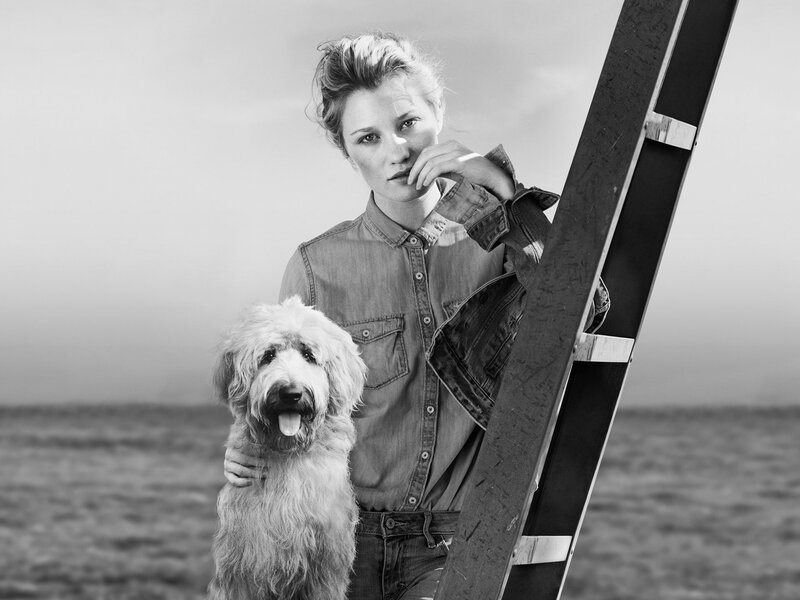Woman with Dog on Beach — Black