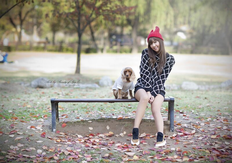 Woman with dog on bench