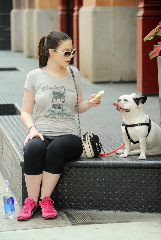 Woman with dog on bench