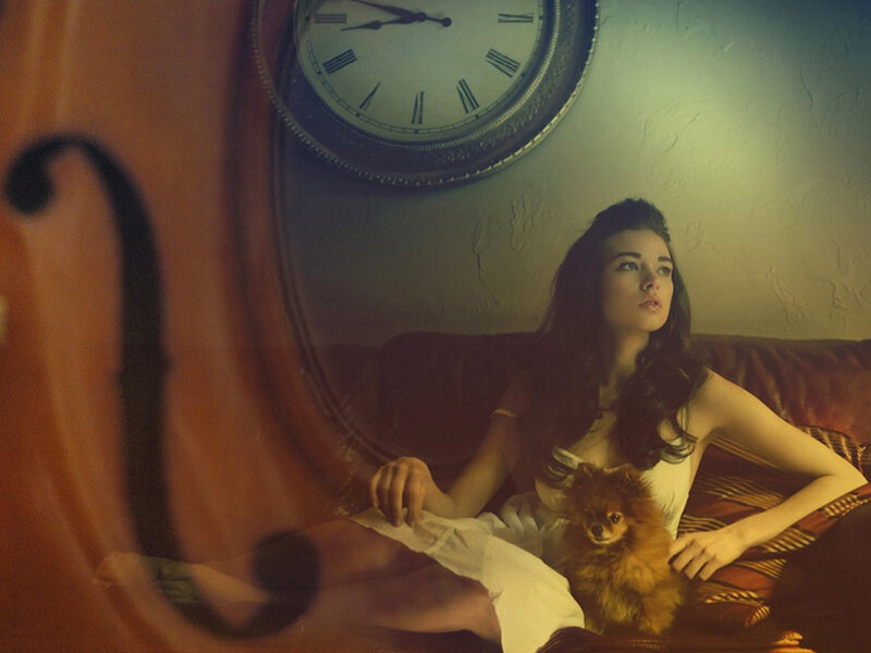 woman with dog on couch