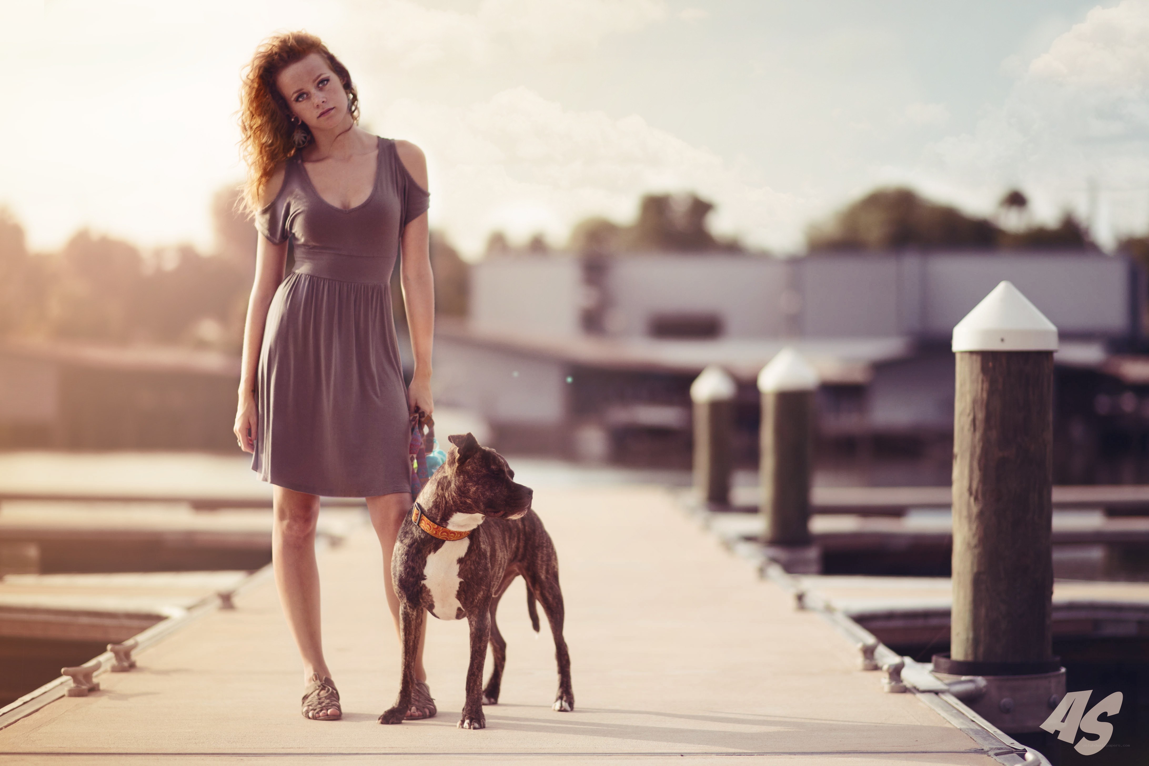 woman with dog on dock