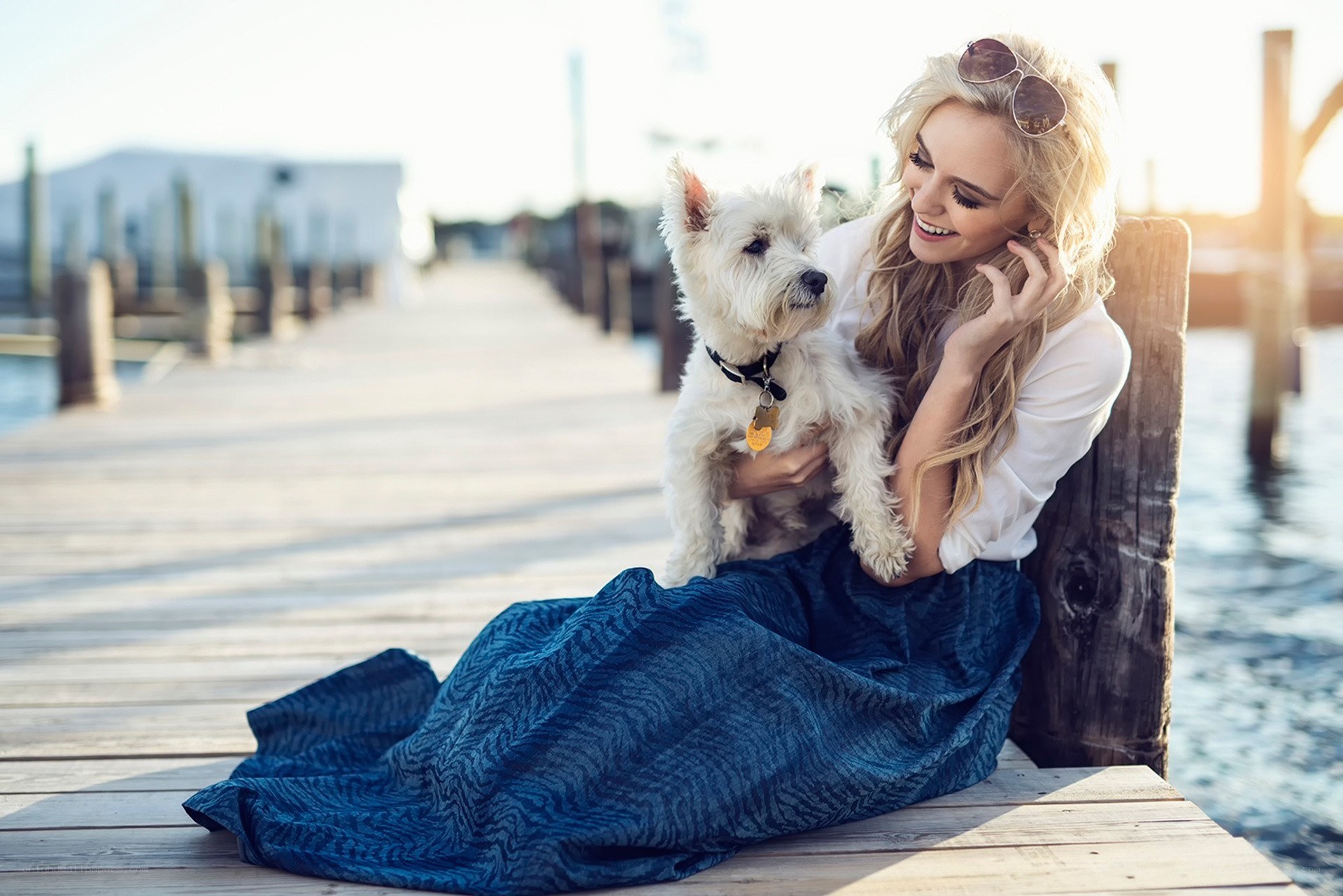 Woman with dog on dock