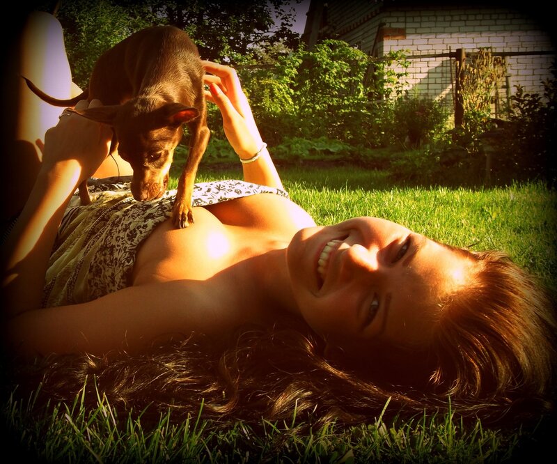 Woman with dog on grass
