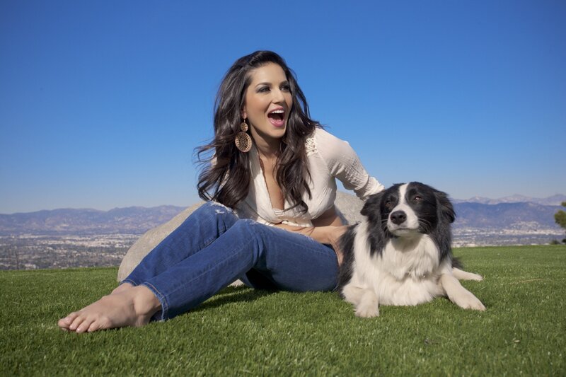 Woman with dog on grass
