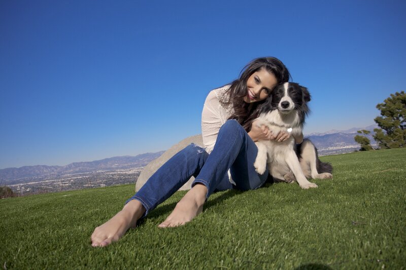 Woman with dog on grass