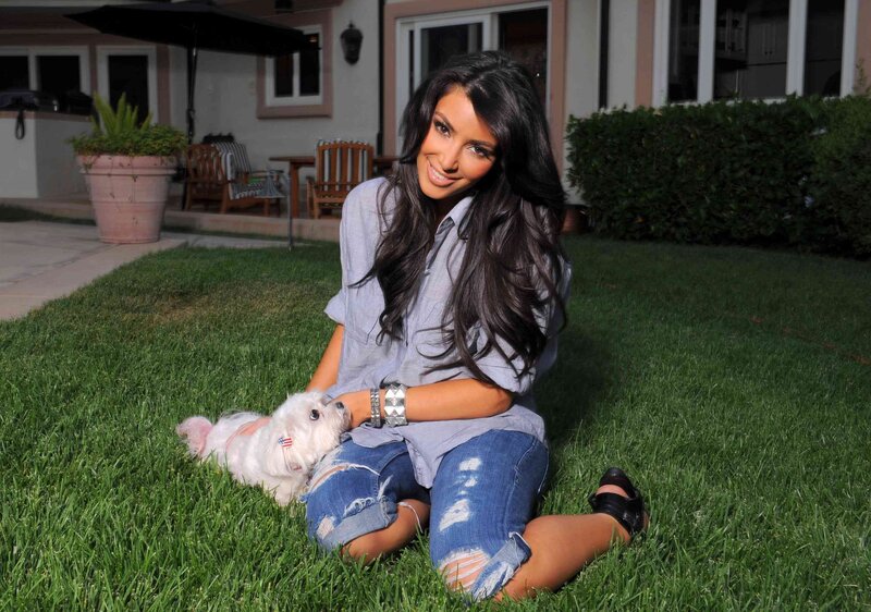 woman with dog on lawn