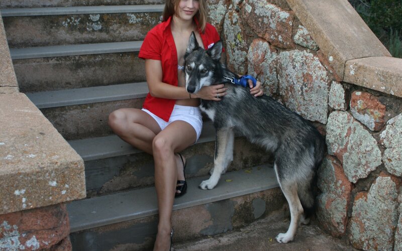 Woman with dog on steps